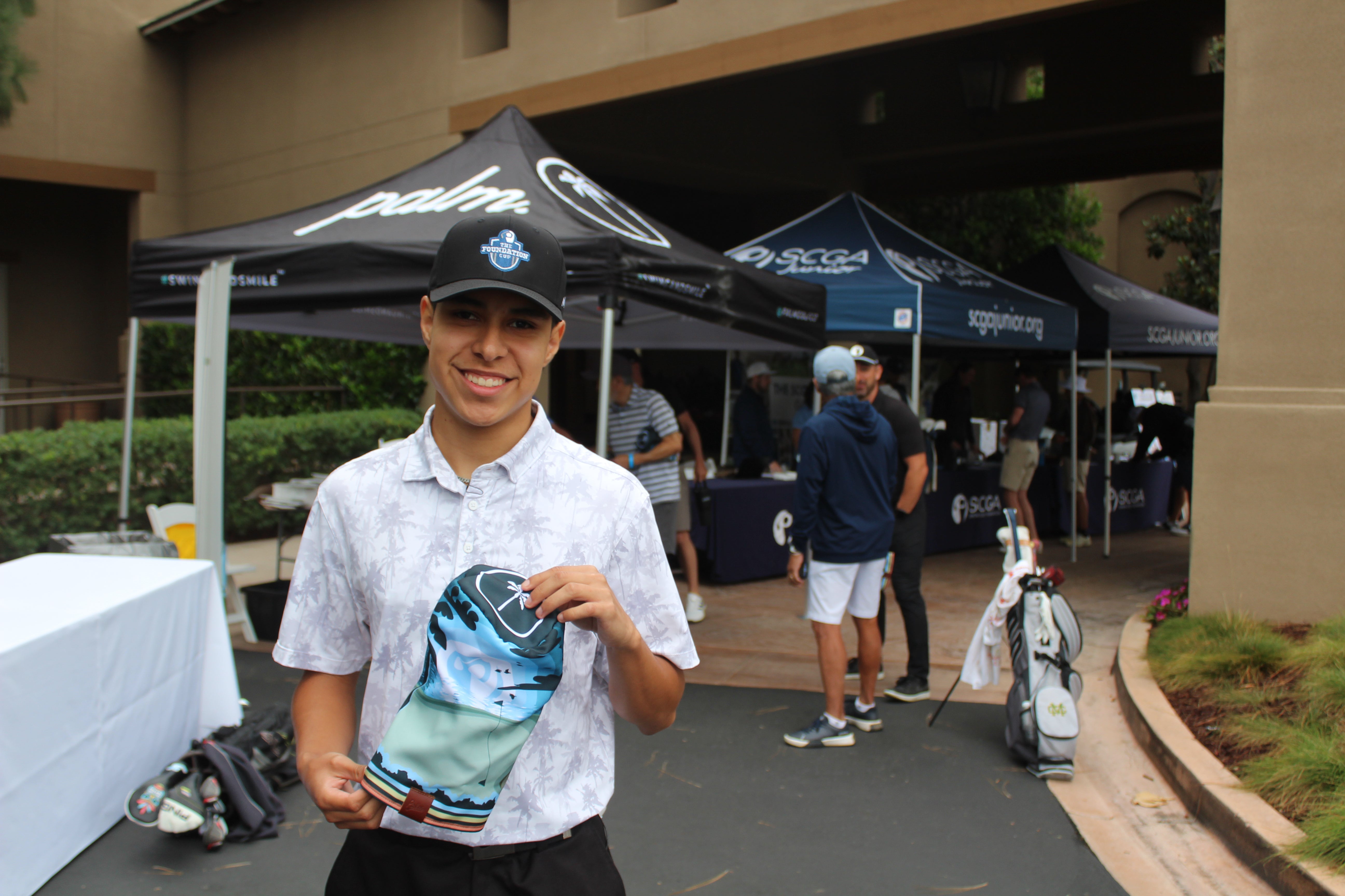 SCGA Junior Dallas Vega Holding his custom headcover